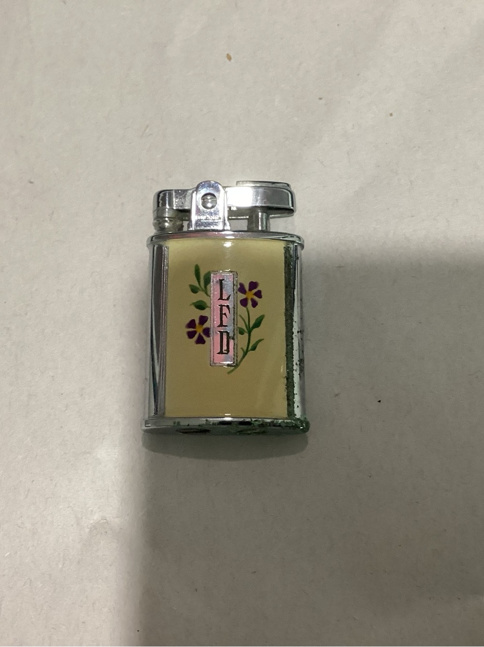 TG. Ronson Gem or Princess pocket lighter with floral emblem design
